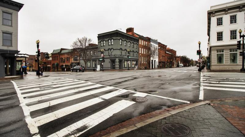 The streets in the shopping district of Georgetown are nearly empty Wednesday on March 25, 2020, in Washington (AP)