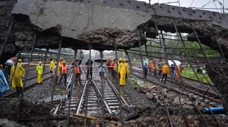 'Estimated loss of property in the collapse of the road overbridge in Mumbai is Rs 88.54 lakh. The Commissioner of Railway Safety, Western Circle, has been nominated to conduct an inquiry. The inquiry is in progress,' the MoS said. (Photo: PTI) 'Estimated loss of property in the collapse of the road overbridge in Mumbai is Rs 88.54 lakh. The Commissioner of Railway Safety, Western Circle, has been nominated to conduct an inquiry. The inquiry is in progress,' the MoS said. (Photo: PTI)