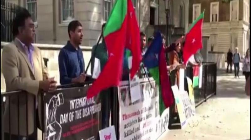 Demonstrators raised slogans against Pakistani Army for abducting, torturing and killing Baloch political activists. (Photo: ANI) Demonstrators raised slogans against Pakistani Army for abducting, torturing and killing Baloch political activists. (Photo: ANI)