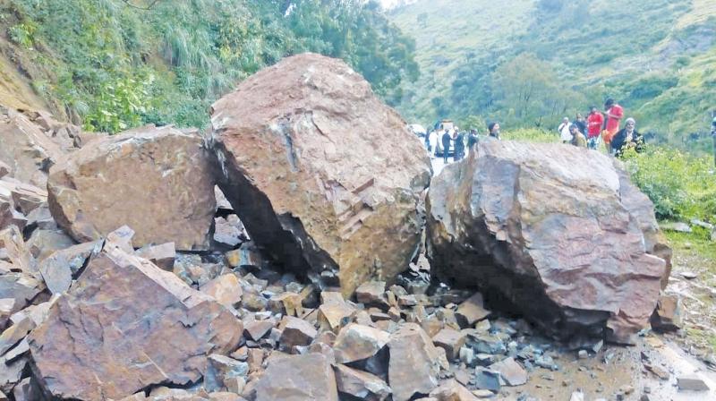 Boulders on the Ooty-Kundah road near Kundah Palam slopes as heavy rains triggered landslip there on Tuesday evening. (Photo: DC) Boulders on the Ooty-Kundah road near Kundah Palam slopes as heavy rains triggered landslip there on Tuesday evening. (Photo: DC)