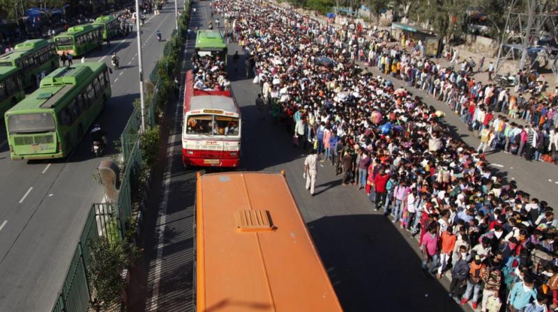 Pictures: Migrant workers walking to native places amid coronavirus scare