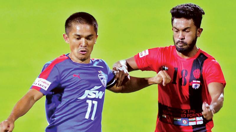 BFC skipper Sunil Chhetri vies for the ball with Souvik Das of Minerva Punjab FC on Saturday. (Photo: R. SAMUEL) BFC skipper Sunil Chhetri vies for the ball with Souvik Das of Minerva Punjab FC on Saturday. (Photo: R. SAMUEL)