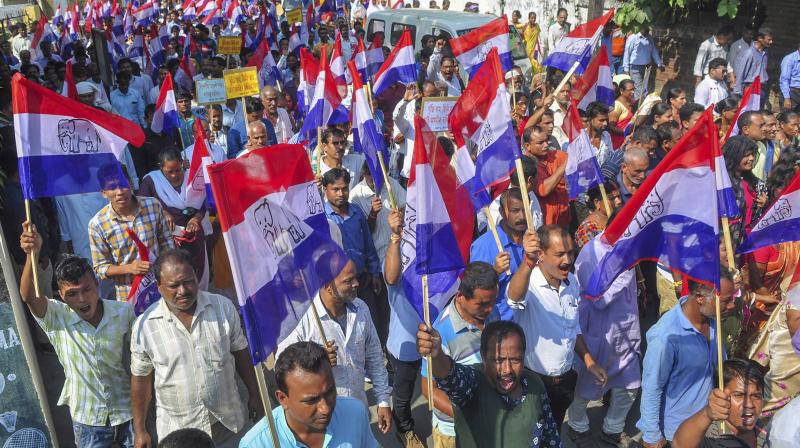Assom Gana Parisahad (AGP) activists take part in a protest rally during 12-hour Assam Bandh, in Guwahati, on Tuesday. (Photo: PTI) Assom Gana Parisahad (AGP) activists take part in a protest rally during 12-hour Assam Bandh, in Guwahati, on Tuesday. (Photo: PTI)