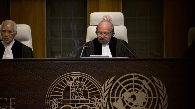Presiding judge Ronny Abraham of France, center, reads the World Court's verdict in the case brought by India against Pakistan in The Hague. (Photo: AP) Presiding judge Ronny Abraham of France, center, reads the World Court's verdict in the case brought by India against Pakistan in The Hague. (Photo: AP)