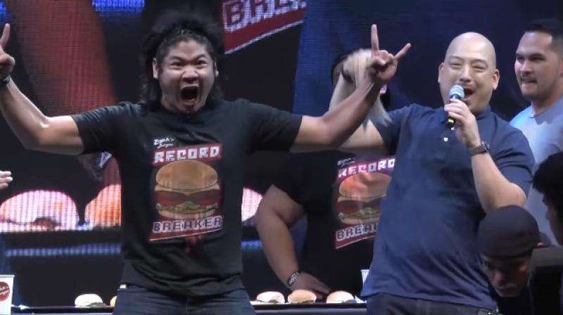 24-year-old Rix Terabite proved he was the hungriest for the record and managed to consume a record-breaking five 107-gram patties in 60 seconds. (Credit: YouTube) 24-year-old Rix Terabite proved he was the hungriest for the record and managed to consume a record-breaking five 107-gram patties in 60 seconds. (Credit: YouTube)