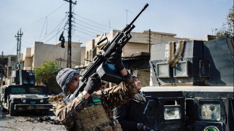 An Iraqi special forces Counter Terrorism Service (CTS) member shoots at a drone flown by Islamic State group jihadists (IS) in Mosul's al-Rifaq neighbourhood on January 8. (Photo: AFP) An Iraqi special forces Counter Terrorism Service (CTS) member shoots at a drone flown by Islamic State group jihadists (IS) in Mosul's al-Rifaq neighbourhood on January 8. (Photo: AFP)
