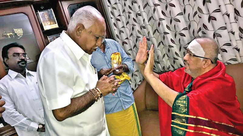 B.S. Yeddyurappa calls on Sri Bharadwaj Swamy, the peetadhipathi of Sri Yoha Maya Sri Bhuvaneswari peetam in the city on Tuesday (Photo: DC) B.S. Yeddyurappa calls on Sri Bharadwaj Swamy, the peetadhipathi of Sri Yoha Maya Sri Bhuvaneswari peetam in the city on Tuesday (Photo: DC)