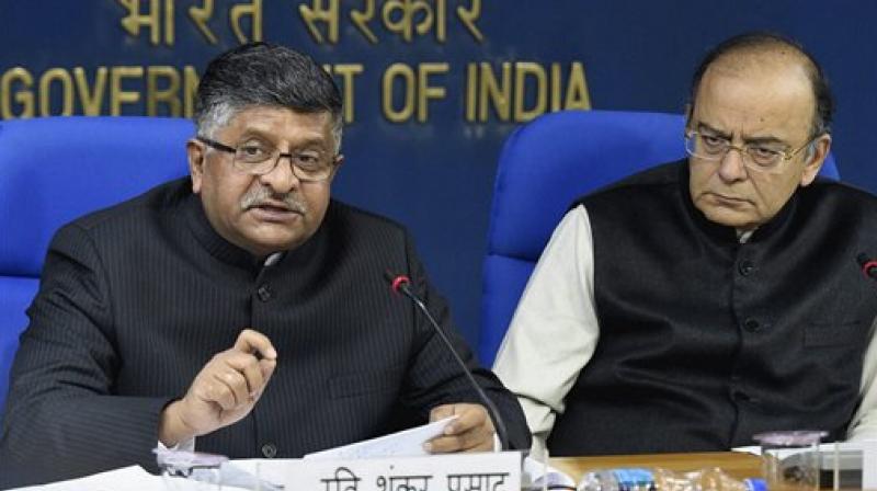 Minister for Electronics & Information Technology, Ravi Shankar Prasad and Finance Minister Arun Jaitley addresses a press conference after cabinet meeting in New Delhi. (Photo: AP) Minister for Electronics & Information Technology, Ravi Shankar Prasad and Finance Minister Arun Jaitley addresses a press conference after cabinet meeting in New Delhi. (Photo: AP)