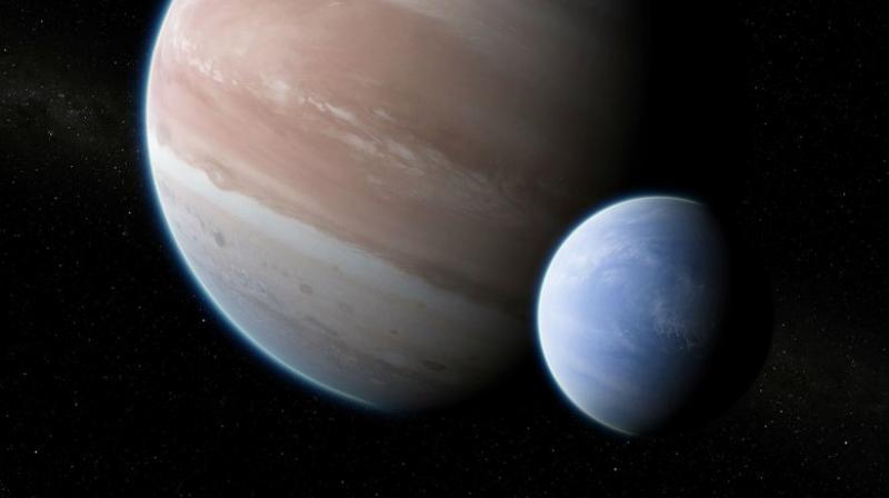 This illustration provided by Dan Durda shows the exoplanet Kepler-1625b with a hypothesized moon. On October 4, 2018, two Columbia University researchers reported their results that the potential exomoon would be the size of Neptune or Uranus. The exoplanet, about 8,000 light-years away, is as big as Jupiter. (Dan Durda via AP) This illustration provided by Dan Durda shows the exoplanet Kepler-1625b with a hypothesized moon. On October 4, 2018, two Columbia University researchers reported their results that the potential exomoon would be the size of Neptune or Uranus. The exoplanet, about 8,000 light-years away, is as big as Jupiter. (Dan Durda via AP)