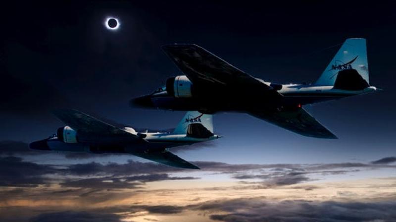(Photo illustration) During the upcoming total solar eclipse, a team of NASA-funded scientists will observe the solar corona using stabilized telescopes aboard two of NASA’s WB-57F research aircraft. This vantage point provides distinct advantages over ground-based observations, as illustrated by this composite photo of the aircraft and the 2015 total solar eclipse at the Faroe Islands. Credits: NASA/Faroe Islands/SwRI (Photo illustration) During the upcoming total solar eclipse, a team of NASA-funded scientists will observe the solar corona using stabilized telescopes aboard two of NASA’s WB-57F research aircraft. This vantage point provides distinct advantages over ground-based observations, as illustrated by this composite photo of the aircraft and the 2015 total solar eclipse at the Faroe Islands. Credits: NASA/Faroe Islands/SwRI