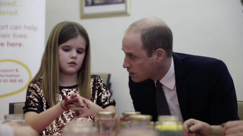 Britain's Prince William speaks with Aoife, 9, during his visit to a Child Bereavement UK Centre in Stratford in east London. (Photo: AP) Britain's Prince William speaks with Aoife, 9, during his visit to a Child Bereavement UK Centre in Stratford in east London. (Photo: AP)