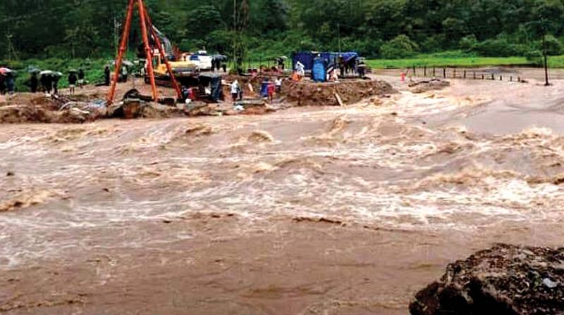 The temporary bridge at Periyavara which connects the Munnar-Udumalpet interstate route constructed after the August flood was washed away in the rains on Thursday. (Photo: DC) The temporary bridge at Periyavara which connects the Munnar-Udumalpet interstate route constructed after the August flood was washed away in the rains on Thursday. (Photo: DC)
