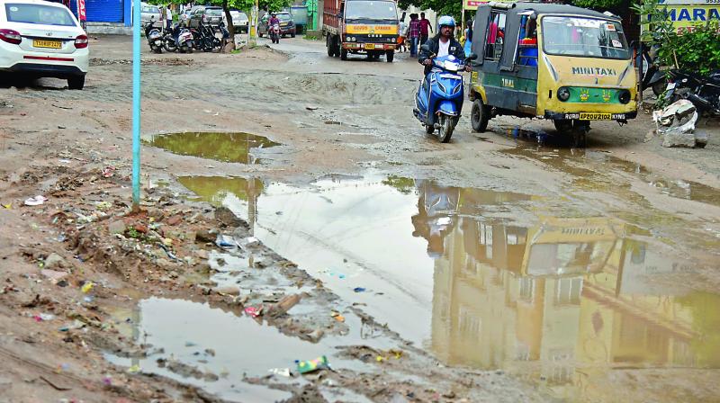 he pathetic condition of the road at Uppal causing inconvenience to the commuters. (Photo: S. Surender Reddy) he pathetic condition of the road at Uppal causing inconvenience to the commuters. (Photo: S. Surender Reddy)