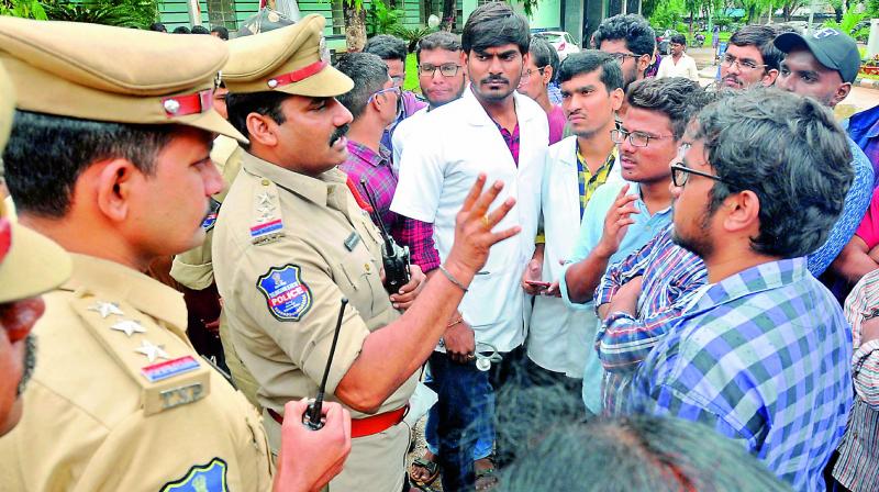 Police officers interact with junior doctors agitating against the Natinal Medical Commission Bill at Osmania Medical College on Saturday. (Photo: P. Surendra) Police officers interact with junior doctors agitating against the Natinal Medical Commission Bill at Osmania Medical College on Saturday. (Photo: P. Surendra)