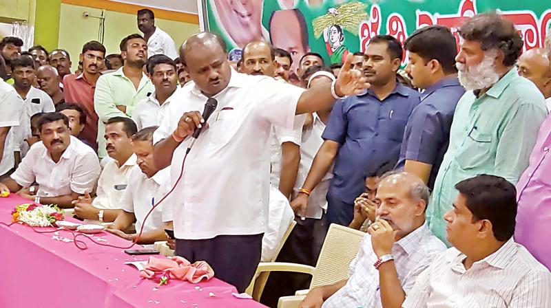 Former CM H.D. Kumaraswamy addresses JD(S) workers at K R Pet in Mandya district on Saturday. (Photo: DC) Former CM H.D. Kumaraswamy addresses JD(S) workers at K R Pet in Mandya district on Saturday. (Photo: DC)