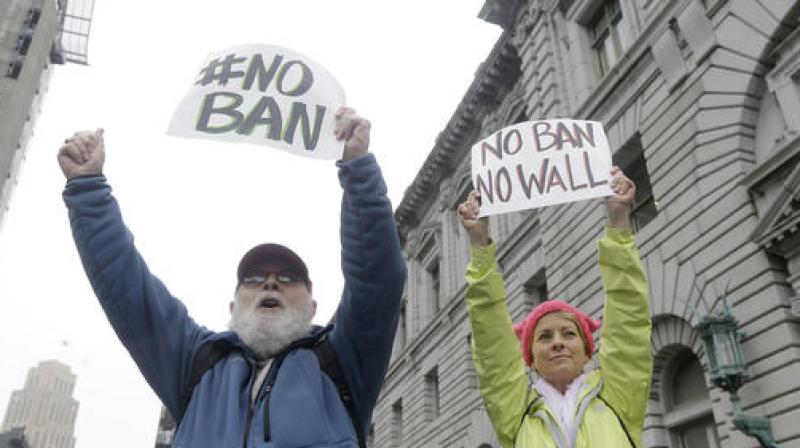 David Pearce and his daughter Crissy Pearce hold signs outside of the 9th US Circuit Court of Appeals in San Francisco. (Photo: AP) David Pearce and his daughter Crissy Pearce hold signs outside of the 9th US Circuit Court of Appeals in San Francisco. (Photo: AP)