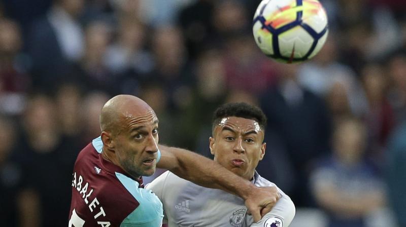 West Ham United's Pablo Zabaleta (L) fights for the ball with Manchester United's Jesse Lingard. AP Photo West Ham United's Pablo Zabaleta (L) fights for the ball with Manchester United's Jesse Lingard. AP Photo