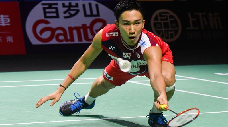 Kento Momota of Japan hitting a retrurn against Viktor Axelsen of Denmark during their mens singles quarter-final match at the Fuzhou China Open badminton tournament in Fuzhou in Chinas eastern Fujian province. - Kento Momota was banned from badminton for gambling in 2016. Fast forward to 2019 and the Japanese has enjoyed one of the most successful years of any sportsman on the planet. (Photo by STR / AFP) / TO GO WITH BADMINTO