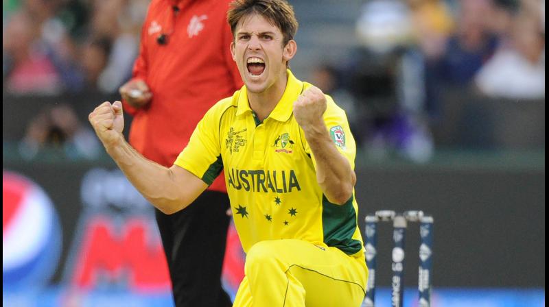 Mitchell Marsh celebrates the wicket of Englands Ian Bell during the Pool A 2015 Cricket World Cup match. AFP PhotoHOTO / MAL FAIRCLOUGH --IMAGE RESTRICTED TO EDITORIAL USE - STRICTLY NO COMMERCIAL USE