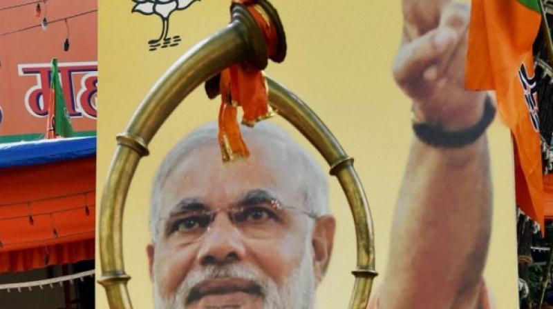 A poster showing photograph of Prime Minister Narendra Modi. (Photo: PTI) A poster showing photograph of Prime Minister Narendra Modi. (Photo: PTI)