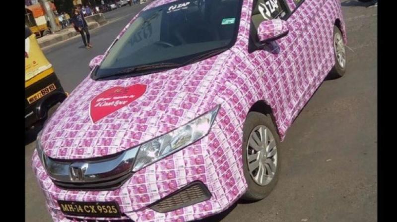 A man in Mumbai thought that plastering his car with Rs 2000 notes will be the best Valentine's gift for his girlfriend. (Credit: YouTube) A man in Mumbai thought that plastering his car with Rs 2000 notes will be the best Valentine's gift for his girlfriend. (Credit: YouTube)
