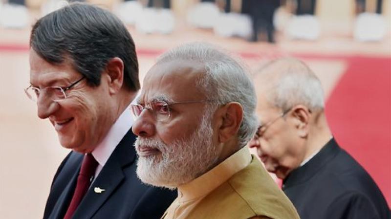 President Pranab Mukherjee and Prime Minister Narendra Modi with Cyprus President Nicos Anastasiades during his ceremonial welcome at the Rashtrapati Bhavan in New Delhi on Friday. (Photo: PTI) President Pranab Mukherjee and Prime Minister Narendra Modi with Cyprus President Nicos Anastasiades during his ceremonial welcome at the Rashtrapati Bhavan in New Delhi on Friday. (Photo: PTI)