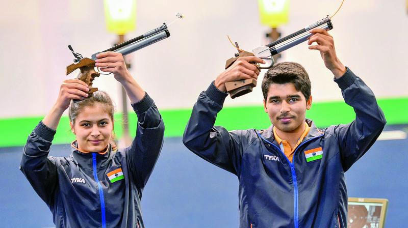 Manu Bhaker and Saurabh Chaudhary pose after winning gold in the 10m Air Pistol Mixed Team event during the ISSF World Cup Rifle/Pistol in New Delhi in this file picture. (Photo: PTI)