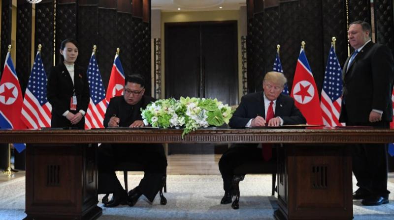 North Korea leader Kim Jong Un and US President Donald Trump sign a document at the Capella resort on Sentosa Island on Tuesday in Singapore. (Photo: AFP) North Korea leader Kim Jong Un and US President Donald Trump sign a document at the Capella resort on Sentosa Island on Tuesday in Singapore. (Photo: AFP)