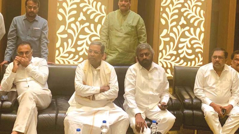 Congress leaders Dinesh Gundurao (seated, from L), Siddaramaiah, Eshwar Khandre and G. Parameshwar at CLP meeting in Bengaluru on Sunday (Photo: DC) Congress leaders Dinesh Gundurao (seated, from L), Siddaramaiah, Eshwar Khandre and G. Parameshwar at CLP meeting in Bengaluru on Sunday (Photo: DC)