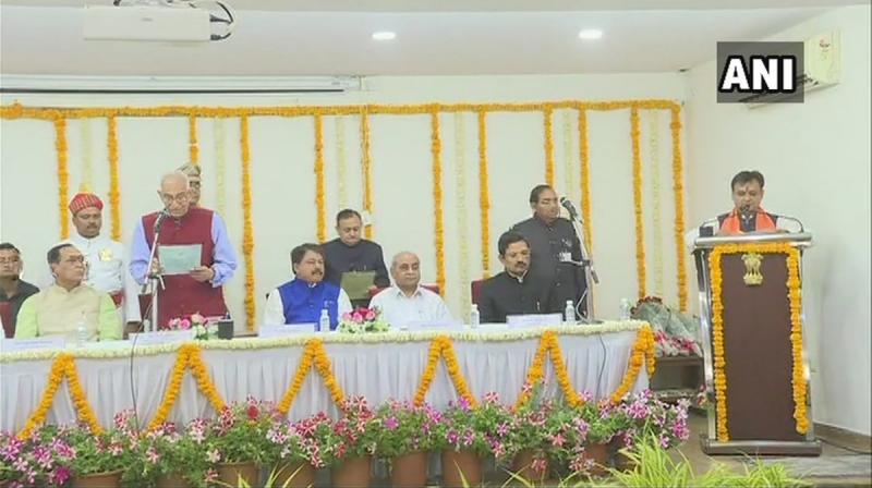 The function was held in the presence of select few including the chief minister, few ministers and some top officials inside the Raj Bhavan without any prior announcement. (Photo: Twitter/ANI) The function was held in the presence of select few including the chief minister, few ministers and some top officials inside the Raj Bhavan without any prior announcement. (Photo: Twitter/ANI)