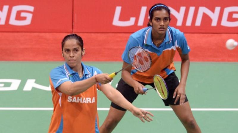 PV Sindhu and Saina Nehwal will share the responsibility in the women's singles events at the Asian Mixed Team Championship. (Photo: AFP) PV Sindhu and Saina Nehwal will share the responsibility in the women's singles events at the Asian Mixed Team Championship. (Photo: AFP)