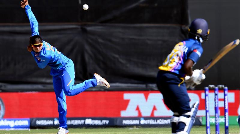 Spinner Radha Yadav tore apart the rival batting line up with a career-best four-wicket haul to help India restrict Sri Lanka to a modest 113 for nine in their ICC Women's T20 World Cup match, here on Saturday. (photo:AFP) Spinner Radha Yadav tore apart the rival batting line up with a career-best four-wicket haul to help India restrict Sri Lanka to a modest 113 for nine in their ICC Women's T20 World Cup match, here on Saturday. (photo:AFP)