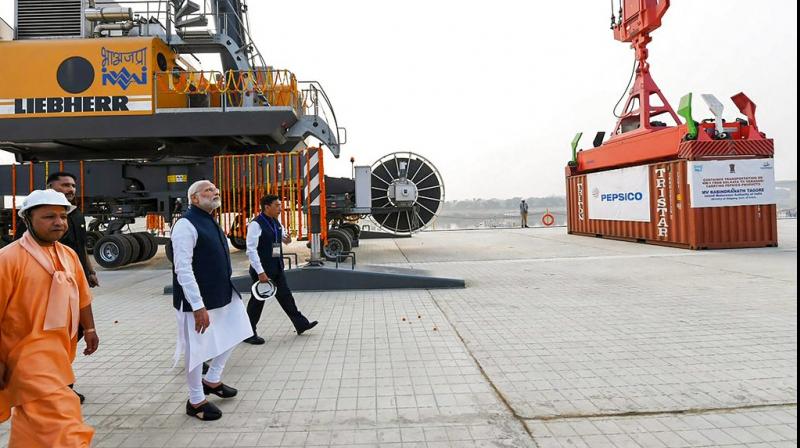 Prime Minister Narendra Modi looks on at India's first multi-modal terminal on the Ganga river during its inaugural function, in Varanasi. (Photo: PTI) Prime Minister Narendra Modi looks on at India's first multi-modal terminal on the Ganga river during its inaugural function, in Varanasi. (Photo: PTI)