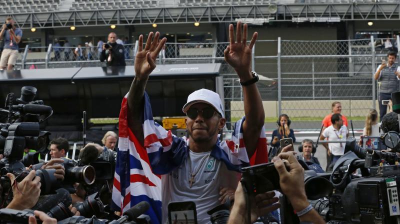 Hamilton's championship makes him the most decorated British driver in F1 history, passing Sir Jackie Stewart. (Photo:AP) Hamilton's championship makes him the most decorated British driver in F1 history, passing Sir Jackie Stewart. (Photo:AP)