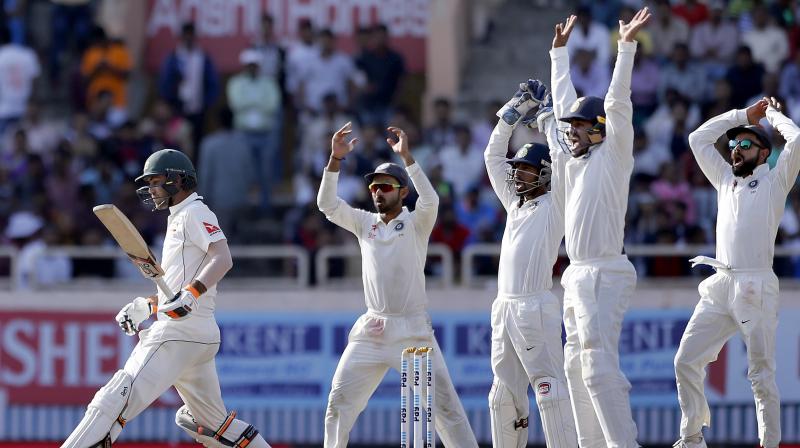 Virat Kohli, right, and teammates appeal unsuccessfully for the dismissal of Australia's Glenn Maxwell, left, during the fifth day of their third test cricket match in Ranchi, India. (Photo: PTI) Virat Kohli, right, and teammates appeal unsuccessfully for the dismissal of Australia's Glenn Maxwell, left, during the fifth day of their third test cricket match in Ranchi, India. (Photo: PTI)