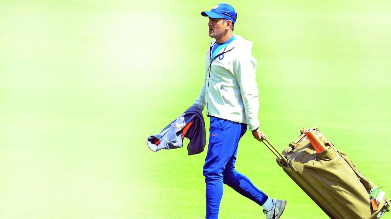 M.S. Dhoni arrives for a training session at the Oval on Saturday. (Photo: AFP) M.S. Dhoni arrives for a training session at the Oval on Saturday. (Photo: AFP)