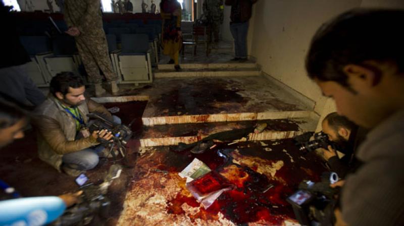 Pakistani journalists film and photograph inside an auditorium of the Army Public School attacked the day before by Taliban gunmen, in Peshawar, Pakistan (Photo: AP) Pakistani journalists film and photograph inside an auditorium of the Army Public School attacked the day before by Taliban gunmen, in Peshawar, Pakistan (Photo: AP)