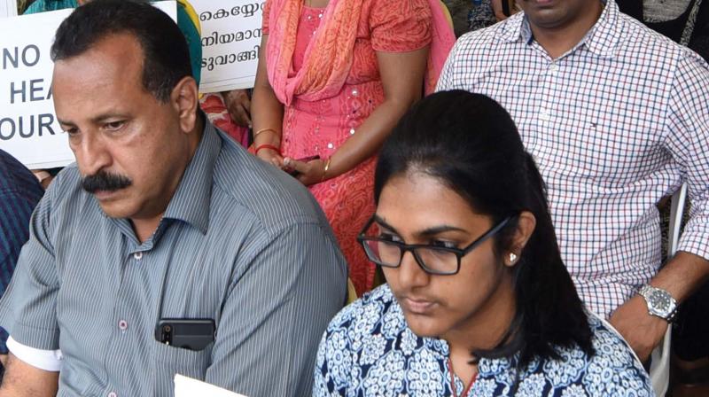 Residents of the flats at Maradu, which have been ordered to be demolished by the Supreme Court, sit in protest before the office of the Maradu Municipality (Photo: DC) Residents of the flats at Maradu, which have been ordered to be demolished by the Supreme Court, sit in protest before the office of the Maradu Municipality (Photo: DC)