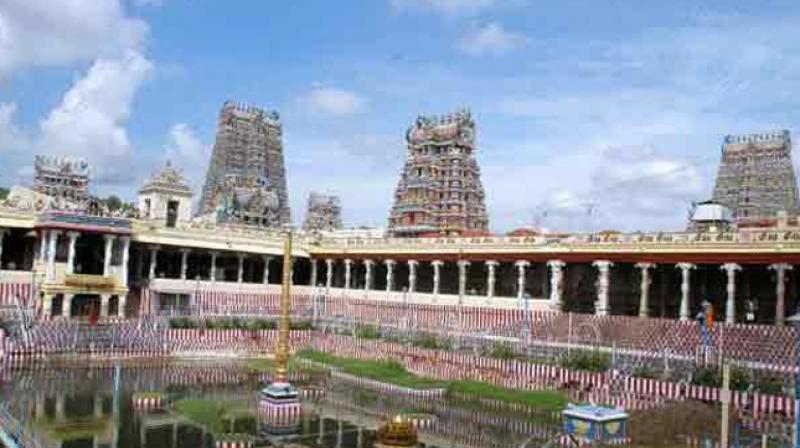 Madras High Court on February 9 banned people other than security officials from carrying mobile phones to the temple where a fire mishap gutted several shops recently. (Photo: PTI) Madras High Court on February 9 banned people other than security officials from carrying mobile phones to the temple where a fire mishap gutted several shops recently. (Photo: PTI)