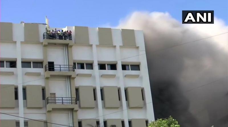 Almost a 100 people are estimated to be trapped in the building. (Photo: ANI) Almost a 100 people are estimated to be trapped in the building. (Photo: ANI)
