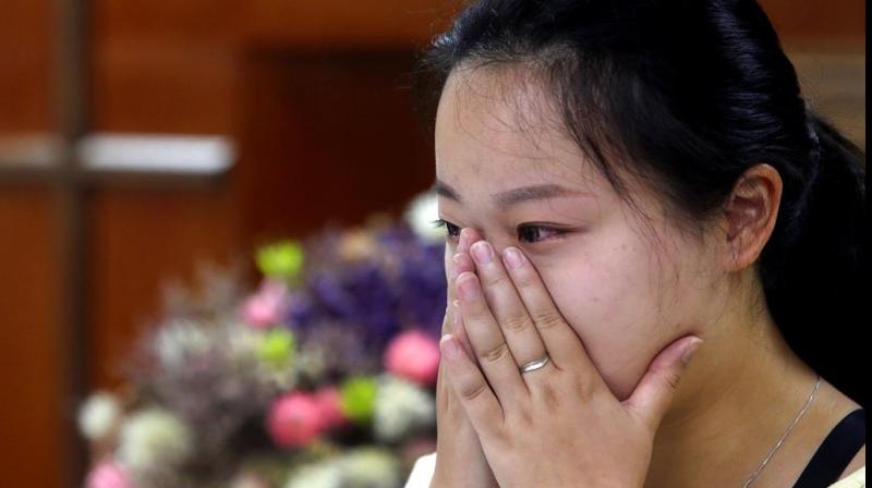 Liao Qiang worships publicly for the first time. (Photo: AP) Liao Qiang worships publicly for the first time. (Photo: AP)