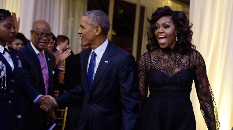 First lady Michelle Obama and President Barack Obama at a BET event on the South Lawn of the White House, in Washington. (Photo: AP) First lady Michelle Obama and President Barack Obama at a BET event on the South Lawn of the White House, in Washington. (Photo: AP)