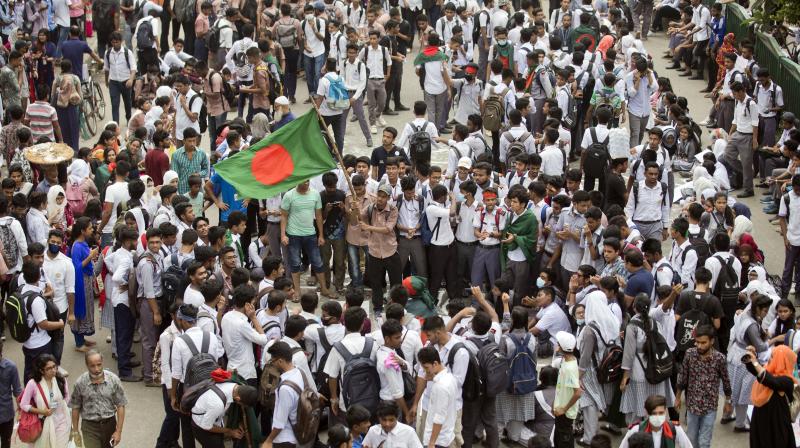 Bangladeshi students shout slogans and block a road during a protest in Dhaka, Bangladesh on Saturday. (Photo: AFP) Bangladeshi students shout slogans and block a road during a protest in Dhaka, Bangladesh on Saturday. (Photo: AFP)