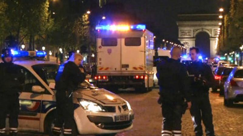 In this image made from video, police attend the scene after an incident on the Champs-Elysees with Arc de Triomphe in background in Paris, Thursday April 20, 2017. (Photo: AP) In this image made from video, police attend the scene after an incident on the Champs-Elysees with Arc de Triomphe in background in Paris, Thursday April 20, 2017. (Photo: AP)