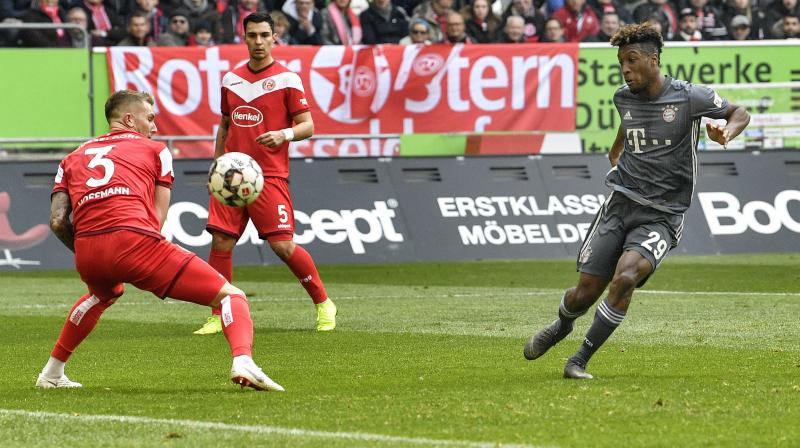 Champions Bayern Munich eased past hosts Fortuna Duesseldorf 4-1 on Sunday with winger Kingsley Coman scoring twice, to go a point clear at the top of the Bundesliga. (Photo: AP) Champions Bayern Munich eased past hosts Fortuna Duesseldorf 4-1 on Sunday with winger Kingsley Coman scoring twice, to go a point clear at the top of the Bundesliga. (Photo: AP)