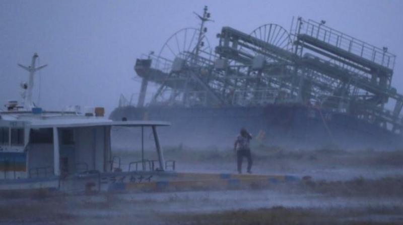 In this Saturday, September 29, 2018, photo, a vessel, rear, tilts on one side as it ran ashore at a pier as a typhoon approached Yonabaru, Okinawa prefecture, southern Japan. (Photo: AP) In this Saturday, September 29, 2018, photo, a vessel, rear, tilts on one side as it ran ashore at a pier as a typhoon approached Yonabaru, Okinawa prefecture, southern Japan. (Photo: AP)