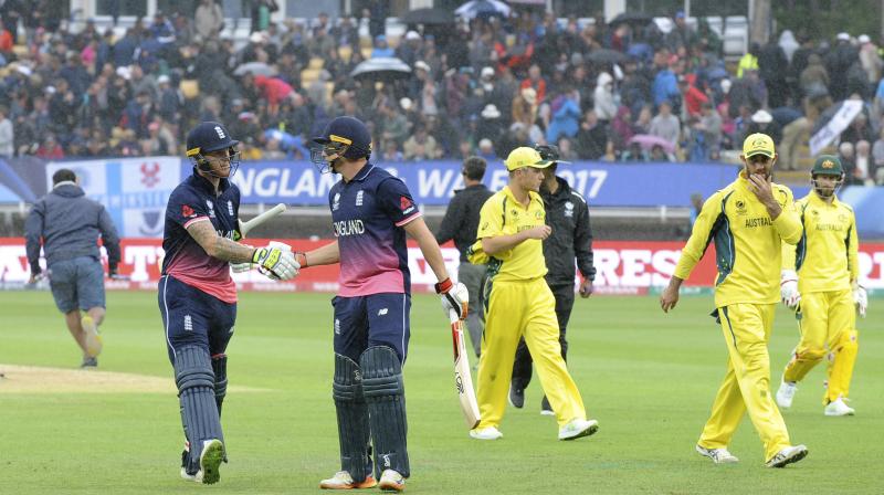 England's Ben Stokes, left, is congratulated by England's Jos Buttler as players leave the field due to rain during the ICC Champions Trophy match between England and Australia at Edgbaston in Birmingham, England, Saturday, June 10, 2017 (Photo: AP) England's Ben Stokes, left, is congratulated by England's Jos Buttler as players leave the field due to rain during the ICC Champions Trophy match between England and Australia at Edgbaston in Birmingham, England, Saturday, June 10, 2017 (Photo: AP)