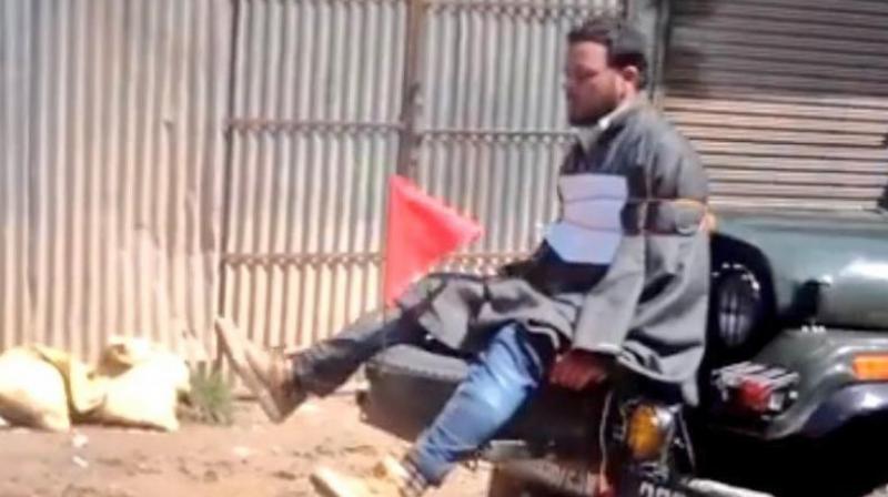 Youth tied to an Army jeep in Jammu and Kashmir (Photo: video grab) Youth tied to an Army jeep in Jammu and Kashmir (Photo: video grab)