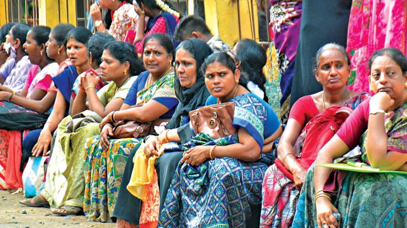 Anxious parents wait outside an examination centre at Chennai. (Photo: DC) Anxious parents wait outside an examination centre at Chennai. (Photo: DC)