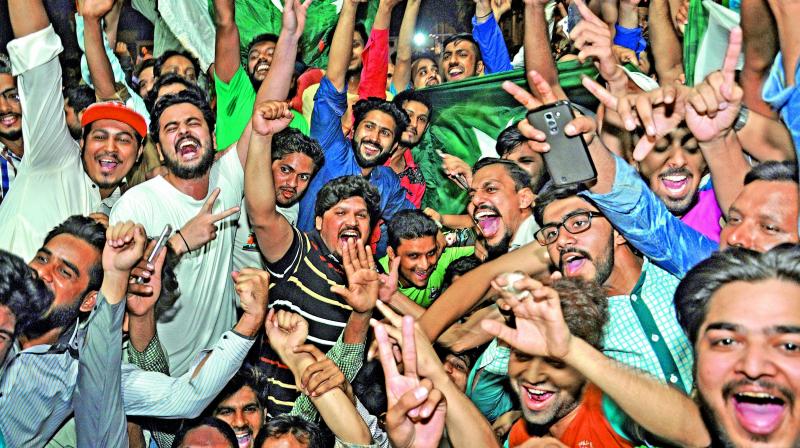 Pakistan fans celebrate their team’s triumph over India in the final of the ICC Champions Trophy on Sunday (Photo: AP) Pakistan fans celebrate their team’s triumph over India in the final of the ICC Champions Trophy on Sunday (Photo: AP)